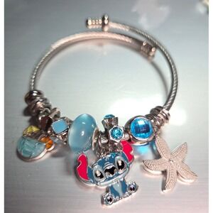 Stitch Charm Bangle Bracelet Silver Tone Twisted Wire Starfish Beads